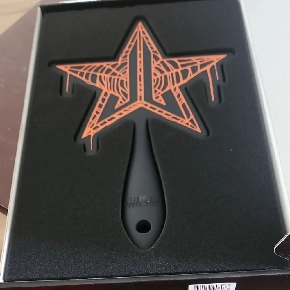 Jeffree Star Black Mirror with Orange Star Design